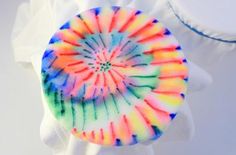 a tie - dyed object sitting on top of a white cloth