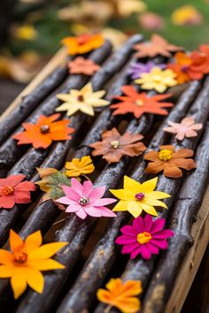 Colorful paper flowers arranged on a wooden surface. Crafts For Elementary Kids, Leaf Creations, Crafts For Elementary, Projects For Elementary Students, Autumn Spirit