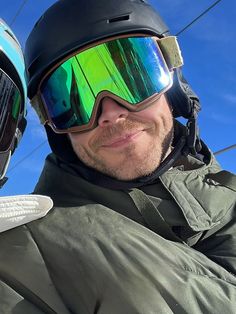 a man wearing ski goggles and a helmet