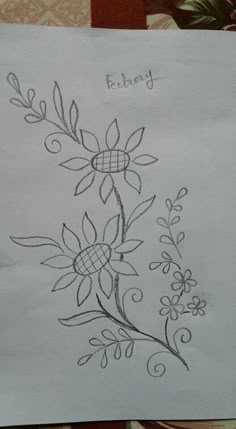 a piece of paper that has been drawn on it with flowers and leaves in the middle