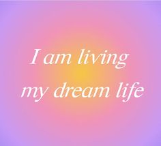 the words i am living my dream life are in white on a pink and purple background