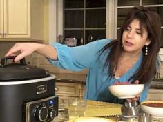 a woman in the kitchen preparing food with an air fryer and slow cooker