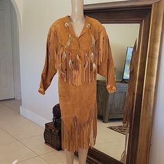 Vtg Suede Leather Fringe, Feathers & Beads. Western Native American Pullover Dress From Late 70's Pre-Owned, Vintage, Does Have One Area Of Light Spots. See Pictures No Holes Or Stiffness In The Leather Approx Measurements Laying Flat: 22" Pit To Pit 19 " Shoulder To Shoulder 43" Total Length 21" Sleeves Light Spots, Leather Fringe, Suede Leather, Nativity, Native American, Feathers, Colorful Dresses, Womens Dresses, Beads