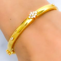 This exquisite 18k gold bangle, weighing 16.4 grams, features a dapper high finish design adorned with dazzling diamonds. The yellow gold finish enhances its luxurious appeal, making it perfect for any special occasion. The bangle is set with 1.1 carats of F-G color, VS quality diamonds in round brilliant cut shapes. With a bangle size of 2.4 and an opening diameter of 2.25 inches, this piece offers both elegance and comfort. Ideal for those who appreciate high-quality craftsmanship and timeless Luxury Gold Bangle With Brilliant Cut, Formal Gold Bangle With Single Cut Diamonds, Gold Luxury Diamond Bracelet With Elegant Design, Gold Diamond Bracelet With Elegant Design, Elegant Gold Diamond Bracelet In Luxury Style, Elegant Gold Diamond Bracelet Luxury Style, Gold Plated Bangle With Diamond Accents, Gold Plated Bangle Bracelet With Diamond Accents, Luxury Gold Bangle With Single Cut Diamonds