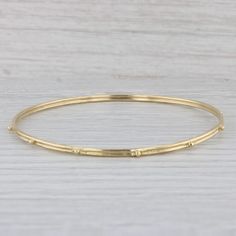 "This Emily Armenta bracelet has a retail value of $2490 so don't pass up this amazing deal. Metal: 18k Yellow Gold (XRF tested) Weight: 8.9 Grams  Style: Bangle Closure: Pull Over Inner Circumference: 8\" Width: 2.5 mm Please note this bracelet is an Emily Armenta piece but the signature hallmark has worn off over time. Each piece is thoroughly examined and refinished as needed by our professional jewelers, graded by our in-house GIA (Gemological Institute of America) Graduate Gemologist, and inspected for quality before being carefully packaged and promptly shipped. [SKU: A6686] phd" Mens Custom Jewelry, Silver Flatware, Fine Jewelry Bracelets, Ancient Artifacts, Estate Jewelry, Bangle Bracelet, Custom Jewelry, Bangle Bracelets, Jewelry Watches