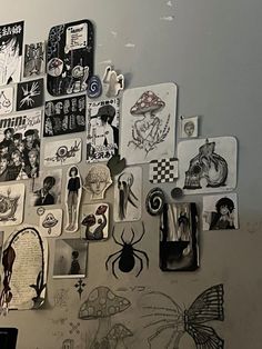 the wall is covered with various stickers and magnets