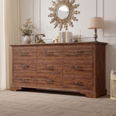 a large wooden dresser with a mirror above it