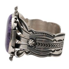 Size: 5 1/4 Width: 1 1.4" Gap: 3/4" Adorn your wrist with the enchanting elegance of this sterling silver cuff handcrafted by Aaron Toadlena and featuring a striking purple Charoite stone. The sterling silver's detailed stamping and silver-work enhance the stone's natural patterns, making this piece a sophisticated and timeless addition to any jewelry collection. Natural Patterns, Turquoise Cuff, Silver Work, Sterling Silver Cuff, Patterns In Nature, Silver Cuff, Jewelry Collection, Gap, Cuff