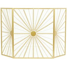 an art deco style fireplace screen in gold and white