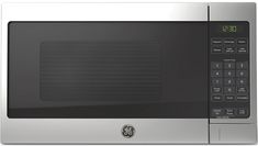 a stainless steel microwave oven with the time displayed on it's display panel and electronic clock