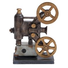 an old fashioned sewing machine with wheels on it's sides and nozzles