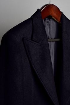 A handmade bespoke coat made from an iconic pure camel hair fabric. Stylish men have chosen the camel for over a hundred years because of its combination of style, versatility and function. You can wear it over everything from a tuxedo (to bring your black-tie outfit to the next level) to sweat pants (for a boss-taking-a-day-off look). Timeless Black Wool Formal Coat, Classic Long Pea Coat For Formal Occasions, Classic Solid Winter Suits, Elegant Solid Wool Sport Coat, Elegant Solid Color Wool Sport Coat, Luxury Long Business Sport Coat, Timeless Black Winter Suits, Wool Long Coat Style Sport Coat For Formal Occasions, Black Timeless Winter Suit