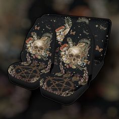 skulls and flowers on black car seat covers with gold stars in the sky behind them