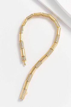 Hand-crafted with 14k gold plating over sterling silver, the smooth tube-style links alternate with clear diamonette-covered links for a delicate, yet confident style. Perfectly balanced on the wrist, this sophisticated bracelet pairs well with classic and modern styles. 14k gold plating, 925 sterling silver, diamonettes 6 3/4 L x 1/8" W Smooth tube-link style Environmentally-safe materials Free of lead, nickel, and cadmium Made in Turkey Ships from the U.S.A. Why we love this product? Just beau Confident Style, Gold Plating, Link Bracelets, Gold Bracelet, Hand Crafted, Gold Plate, Plating, 925 Sterling Silver, Ships