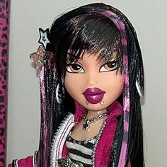 a close up of a doll with long black hair and pink lipstick on her face