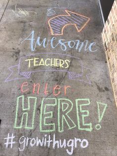 chalk writing on the sidewalk that says awesome teachers enter here