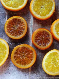 oranges cut in half sitting on top of a table