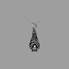 "Sterling Silver Bat Necklace. Made from high quality recycled sterling silver, this necklace is not only visually captivating but also durable. It's a striking symbol of both elegance and the mystique of the night. This necklace  captures the essence of the nocturnal world in stunning detail. The bat is lovely from all sides - the ribbed wings wrap from front to back, and she has a sweet face with a long nose and pointy ears. Measurements: charm 19mm x 8mm and comes on your choice of a 16\", 18 Gothic Sterling Silver Necklace With Lobster Clasp, Halloween Sterling Silver Pendant Necklace, Black Sterling Silver Necklace With Charms, Sterling Silver Charms Necklace For Halloween, Sterling Silver Halloween Pendant Jewelry, Black Sterling Silver Necklace For Halloween, Halloween Engraved Sterling Silver Necklaces, Black Sterling Silver Nickel-free Charm Necklace, Black Nickel-free Sterling Silver Charm Necklace