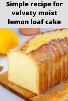 a lemon loaf cake on a cutting board with the words simple recipe for velvety moist lemon loaf cake