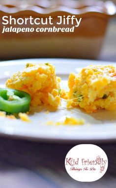 an egg muffin with jalapeno and cheese is on a white plate