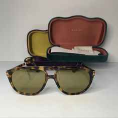 Gucci Stripe 0525 Havana Green Stripe Sport Aviator Sunglasses Gg0525s Unisex Brand:Guccisku:6686541model: Gg0525slens Color: Greencolor: 004frame Color: Browntemple Length: 145 Mmlens Material: Polycarbonatedepartment: Menlens Technology: Anti-Reflectivepattern: Stripedtype: Sunglassesstyle: Aviatortheme: Sportprotection: 100% Uva & Uvbfeatures: Pilotframe Material: Acetate Metaluv Protection: Uvb Designer Aviator Sunglasses With Mirrored Lenses, Gucci Brown Aviator Sunglasses With Uv Protection, Gucci Brown Tinted Aviator Sunglasses, Gucci Designer Aviator Sunglasses With Tinted Lenses, Luxury Green Gucci Sunglasses, Gucci Accessories, Tinted Sunglasses, Colored Sunglasses, Aviator Sunglasses