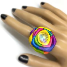 Dear customers, for a price offer of expedited shipping outside of Germany, please contact me directly via Etsy messages. A Multicolored satin rainbow rose ring, in two sizes options, with or without crystal, made to go with your pride parade dress, special event or any colorful pastel goth outfit. Pastel Goth is a fashion that originated on Tumblr in early 2010s. The fashion entails taking the basic elements of dark goth style and mixing it with pastel colors. It also became popularized in Japa Unique Rainbow Rings For Gifts, Unique Rainbow Rings As Gift, Unique Rainbow Colored Rings As Gift, Lgbtq Jewelry, Rose Rings, Goth Ring, Parade Dress, Kawaii Pastel Goth, Early 2010s