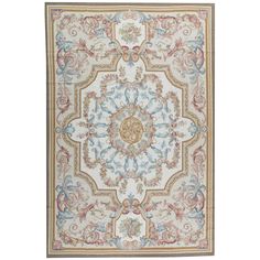 a rug with an ornate design on the front and back side, in beige, blue,