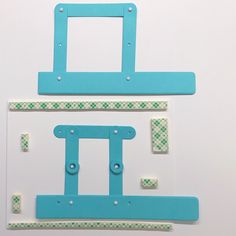 two pieces of paper cut out to look like frames