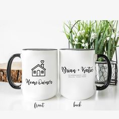 two coffee mugs sitting next to each other on top of a white countertop