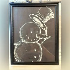 a drawing of a snowman wearing a top hat