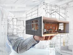 a man holding up a house model in front of blueprinted architectural drawings and the words express draft