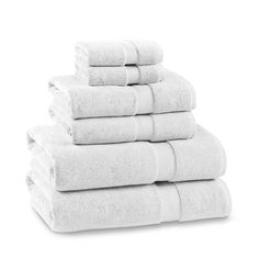 six white towels stacked on top of each other