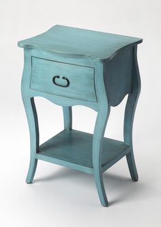 a small blue table with one drawer open