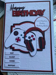 a birthday card with two video game controllers