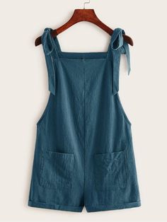 This Pocket Patched Pinafore Romper is the perfect addition to any wardrobe! This stylish romper features two front pockets, knot detailing, and adjustable straps for a custom fit. It's made from cotton fabric in a classic plain pattern that will look great paired with any outfit. The comfortable regular fit allows for plenty of movement while still looking chic and fashionable. Whether you're heading out to the park or just lounging around at home, this pocket-patched pinafore romper is sure to Casual Cotton Sleeveless Shortalls, Sleeveless Cotton Shortalls, Casual Style, Summer Cotton Overalls In Solid Color, Cotton Sleeveless Shortalls For Spring, Sleeveless Cotton Shortalls For Spring, Spring Sleeveless Cotton Shortalls, Sleeveless Cotton Overalls In Solid Color, Spring Cotton Overalls In Solid Color, Casual Cotton Jumpsuits And Rompers With Tie Straps