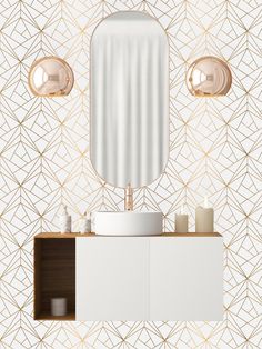 a modern bathroom with gold geometric wallpaper and white cabinetry, along with two round lights