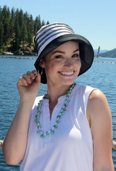 "Summer sale! $13.99 marked down from $23.99 Our Seaside Sun Hat for women is fully lined with no exposed seams, making it an ideal summer hat for cancer patients. Soft and soothing on tender bald heads. Cool, lightweight and packable. 100% premium cotton for superior breathability. Contrasting top stitching and under brim ups the cuteness factor and adds a touch of color. Weighing just 1.5 ounces, this lightweight sun hat is a perfect chemo hat for women. The three inch brim shades your eyes and neck without being overbearing. Great sun protection on your neckline. A nice deep crown provides full coverage over the ears and neckline, protecting your delicate skin from the sun .A must in cancer headwear for women. Turn the brim up or down to suit your mood. Whether you're off to Europe or j Chemo Headwear, Summer Hats For Women, Travel Hat, Contrast Top, Sun Protection Hat, Exposed Seams, Bald Heads, Chemo Hat, Sun Hats For Women