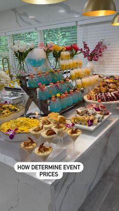 a buffet table filled with lots of different types of desserts and pastries on it