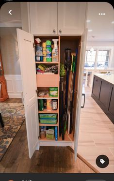 the inside of a closet with many items in it and an open door on one side