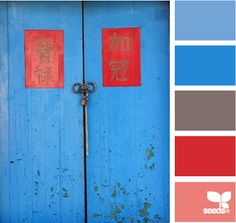 a blue door with two red signs on it and the word love written in chinese