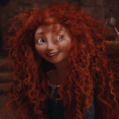 a close up of a doll with long red curly hair and blue eyes looking at the camera