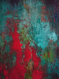 an abstract painting with red, green and blue colors