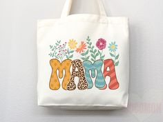 a tote bag with the word mama written in colorful letters and flowers on it