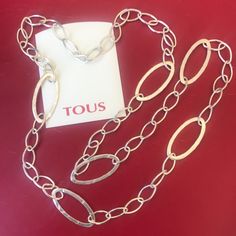 Substantial Long Tous Sterling Silver Link Necklace With 6 Large Hammered Ovals. 44” (112 Cm) End To End. 22” Long When Closed. I Don’t Have The Silver Gram Weight But This Is A Lot Of Silver. Reference # 616642610 Purchased At Tous Boutique In Cancun, Mexico. Gorgeous Piece That Can Be Worn Long Or Wrapped Around Neck Twice. Perfect Condition! I Only Wore It A Few Times. Stunning! Metal Toggle Necklace With Rectangular Links For Gift, Formal Silver Long Necklace, Luxury Long Silver Necklace, Luxury Silver Long Necklace, Nickel-free Long Charm Necklace For Gift, Elegant Red Necklaces With Sterling Silver Clasp, Silver Reference, Elegant Metal Toggle Necklace, Tarnish Resistant, Nickel-free Red Metal Charm Necklaces