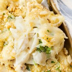 a casserole dish with broccoli and cheese