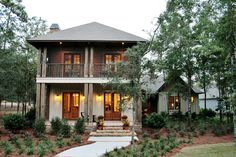 a large house surrounded by trees and bushes