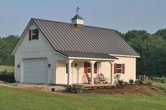 a small white barn with a red door and two windows on the side of it