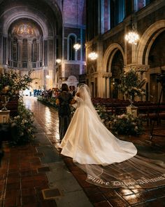 the bride and groom are walking down the aisle