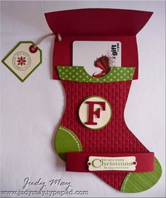 a christmas stocking with the letter f on it and a tag attached to it