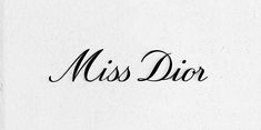 the word miss dior written in cursive writing on a white paper background